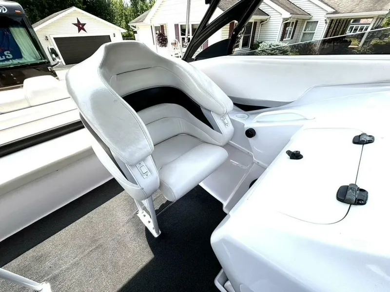 Slide: The Image of 2005 Donzi 33ZX boat interior with white seating and sleek design. - 19