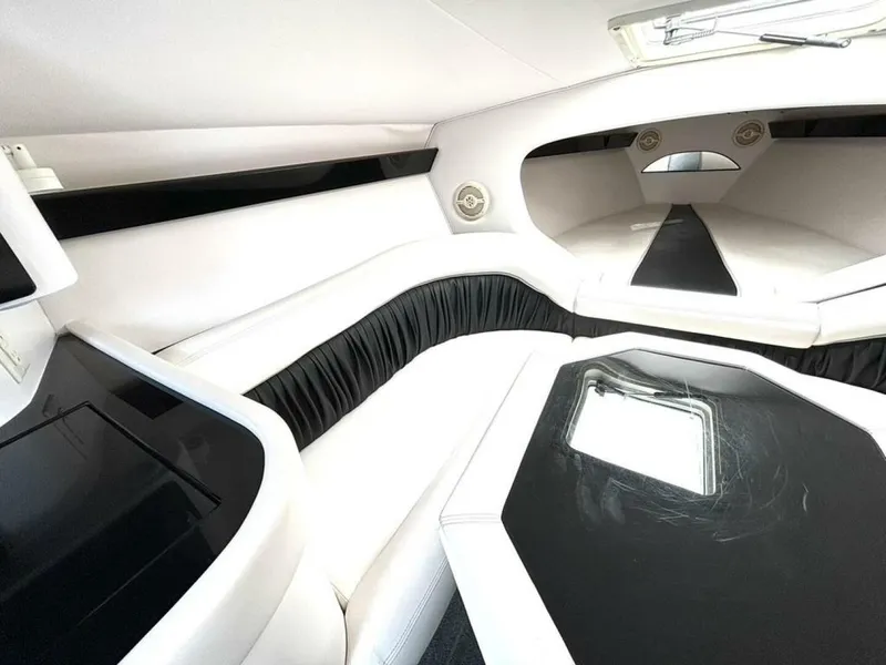 Slide: The Image of Interior of 2005 Donzi 33ZX boat, featuring sleek white and black seating and modern design. - 31