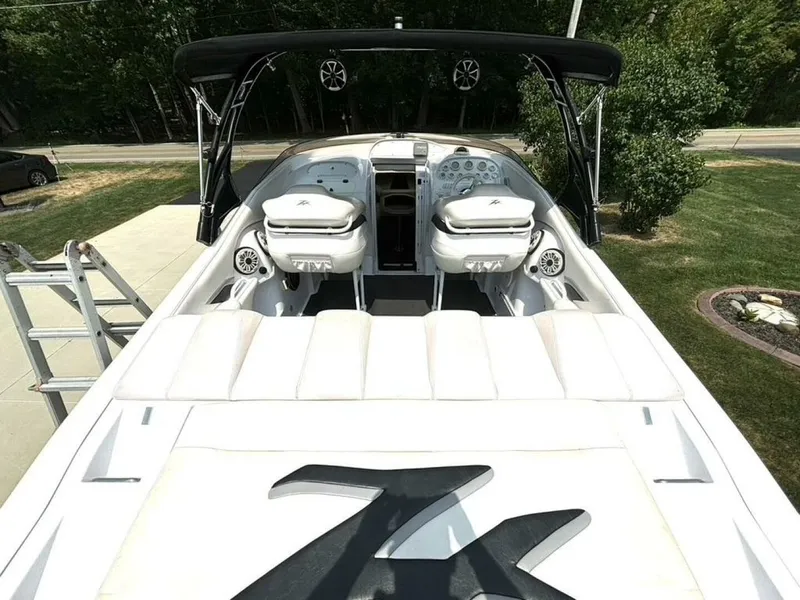 Slide: The Image of 2005 Donzi 33ZX boat interior with white seating and black canopy. - 16