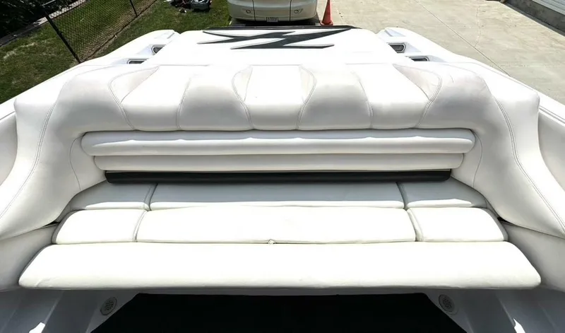 Slide: The Image of 2005 Donzi 33ZX boat with white cushioned seating and sleek design. - 17