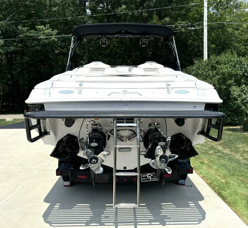Slide: The Image of 2005 Donzi 33ZX boat rear view with dual propellers and swim ladder. - 4