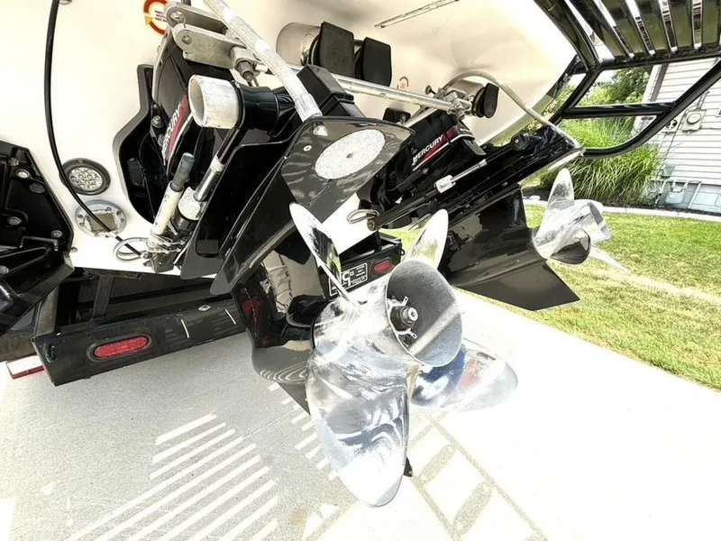 Slide: The Image of 2005 Donzi 33ZX boat with dual Mercury outboard motors and stainless steel propellers. - 11