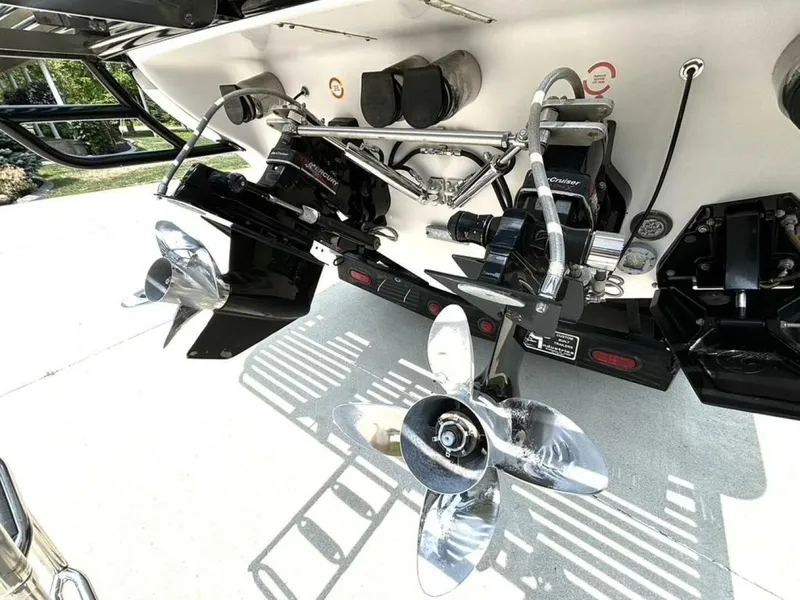 Slide: The Image of 2005 Donzi 33ZX boat stern with dual propellers and outboard motors. - 12