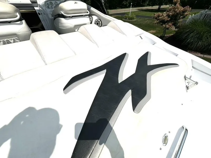 Slide: The Image of 2005 Donzi 33ZX boat interior with white seating and black logo detail. - 15