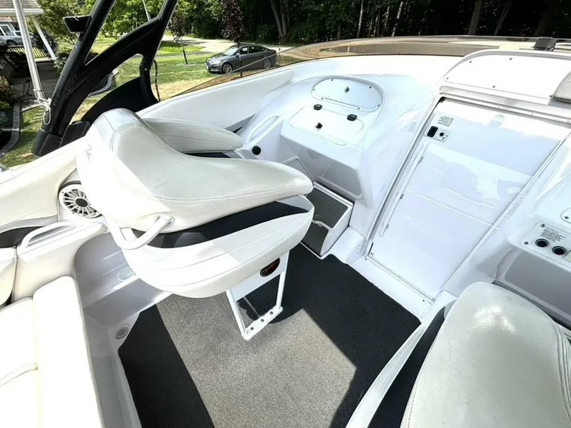 Slide: The Image of 2005 Donzi 33ZX boat interior with white seating and control panel. - 18