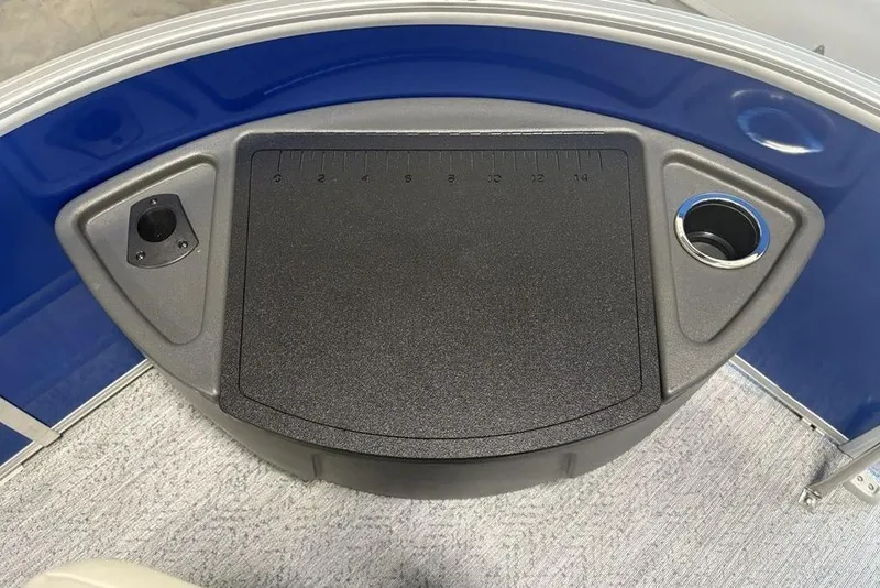 Slide: The Image of 2026 Sun Tracker Fishin' Barge 20 DLX deck with cup holder and measuring board. - 13