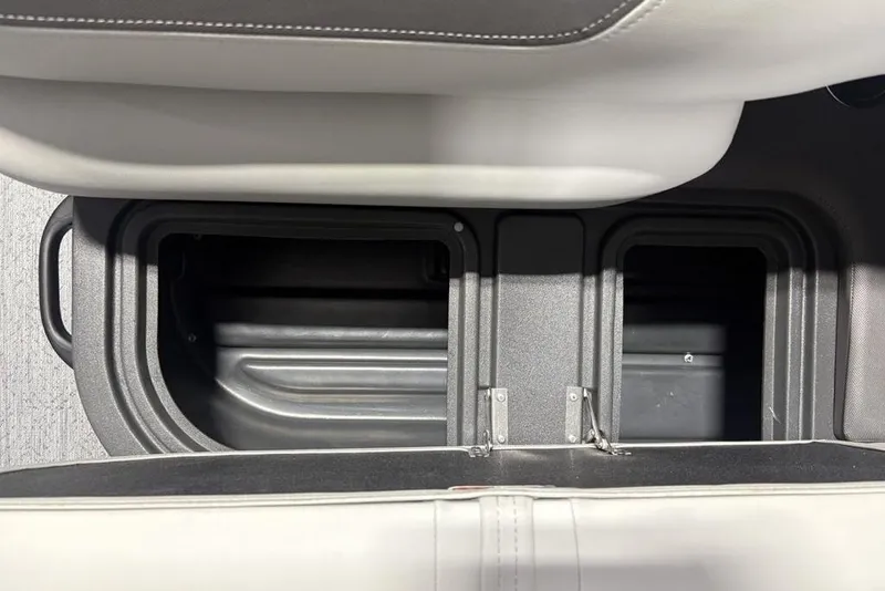 Slide: The Image of Storage compartments on a 2026 Sun Tracker Fishin' Barge 20 DLX boat. - 25