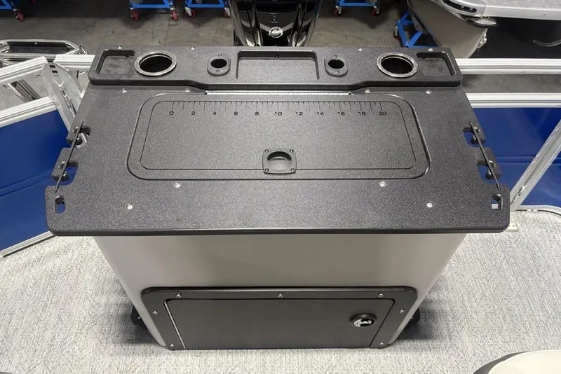 Slide: The Image of 2026 Sun Tracker Fishin' Barge 20 DLX fishing station with built-in ruler and cup holders. - 32