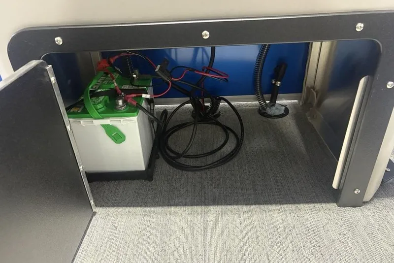 Slide: The Image of Battery compartment of 2026 Sun Tracker Fishin' Barge 20 DLX with wiring. - 33