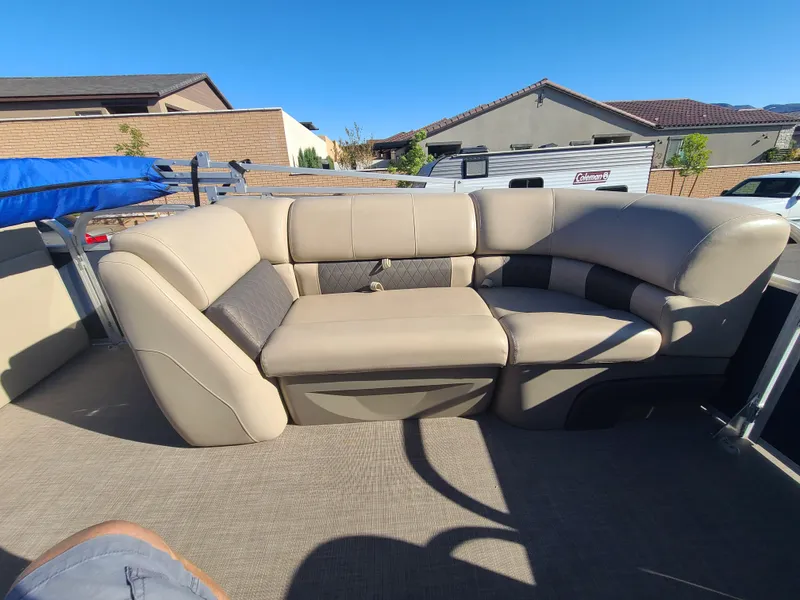 Slide: The Image of 2022 Sun Tracker Party Barge 20 DLX interior seating with beige upholstery. - 7