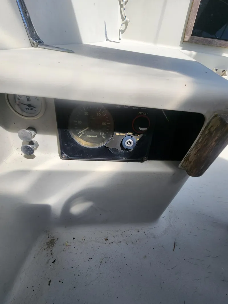 Slide: The Image of Dashboard of a 1982 C&C 34 sailboat with gauges and controls. - 30