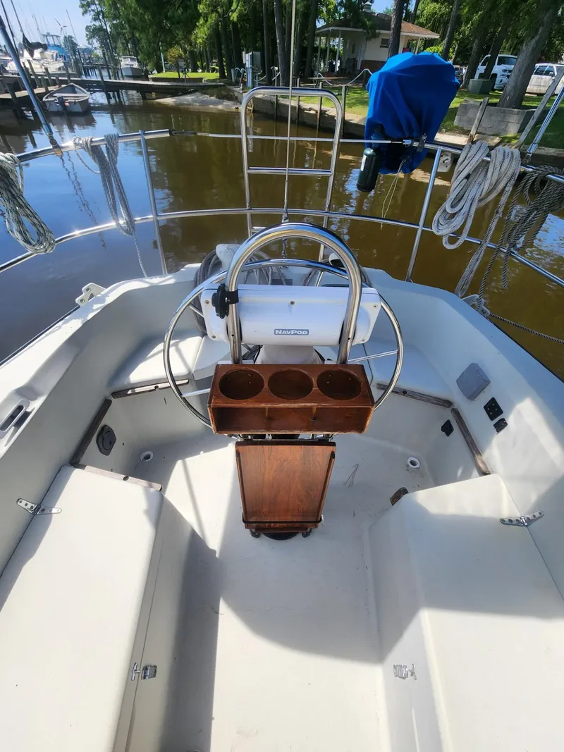 Slide: The Image of Cockpit of a 1982 C&C 34 sailboat with steering wheel and cup holders. - 7