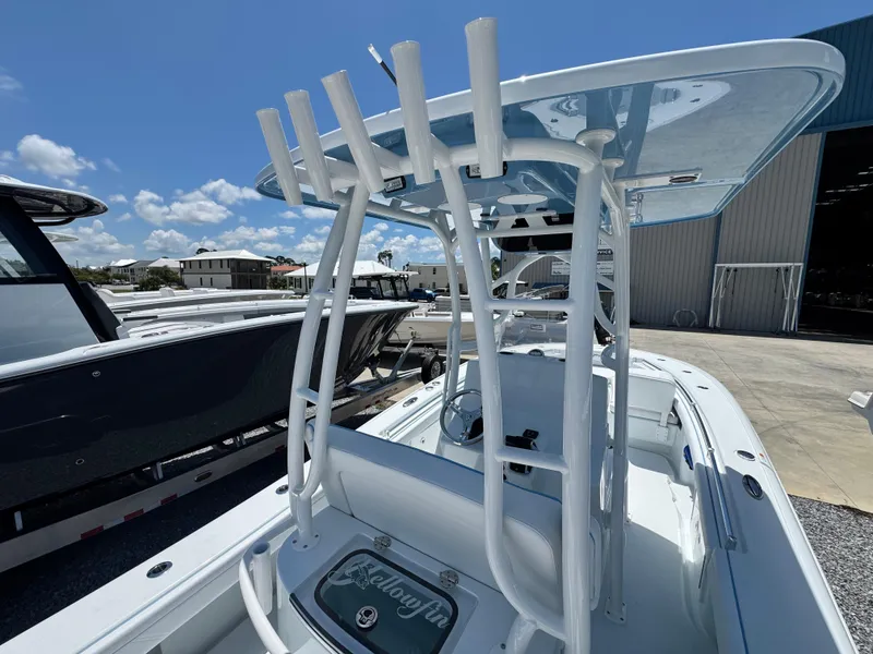 Slide: The Image of 2026 Yellowfin 26 Hybrid boat seat with white and blue upholstery. - 15