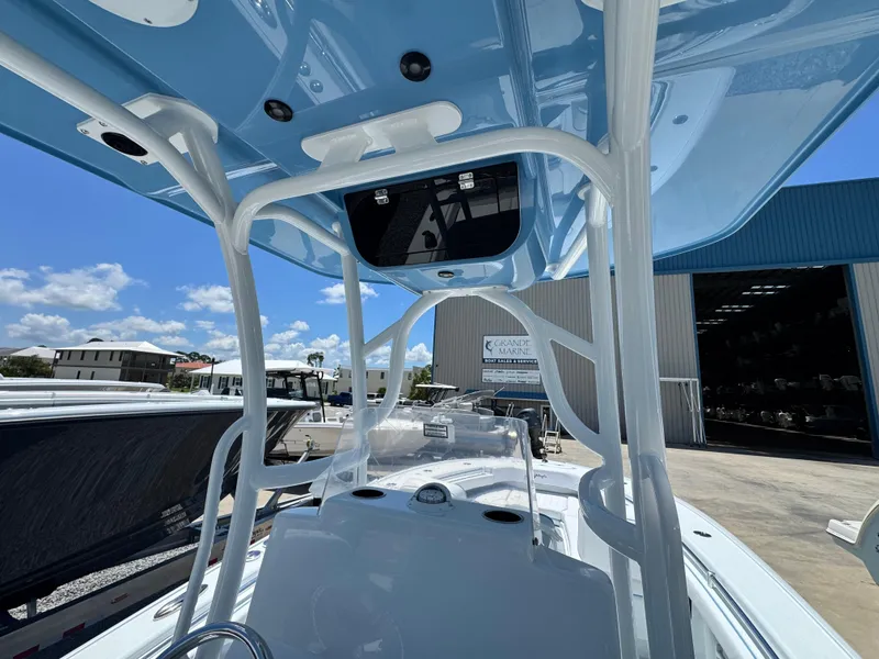 Slide: The Image of 2026 Yellowfin 26 Hybrid boat interior with storage compartment and seating. - 24