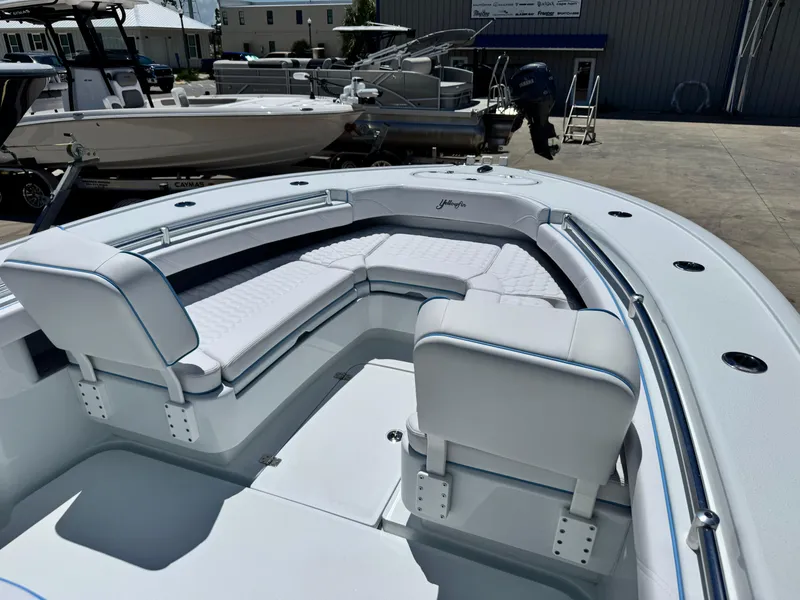 Slide: The Image of 2026 Yellowfin 26 Hybrid boat interior with white seating and modern design. - 8