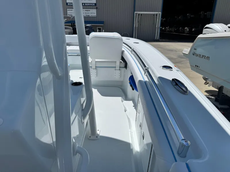 Slide: The Image of 2026 Yellowfin 26 Hybrid boat with luxurious white seating and spacious deck. - 9