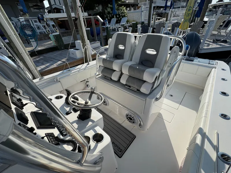 Slide: The Image of 2022 Contender 32 ST boat interior with dual seats and steering console. - 12