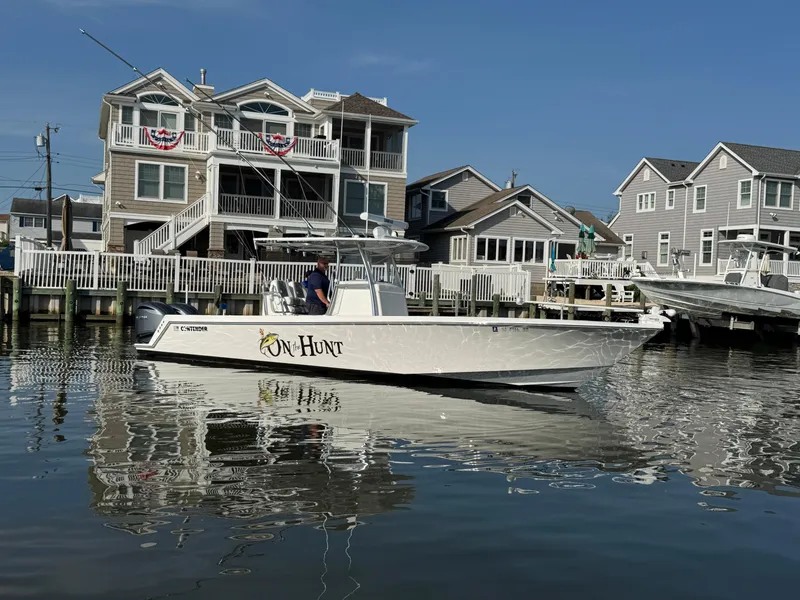 Slide: The Image of 2022 Contender 32 ST boat on water near waterfront homes. - 5