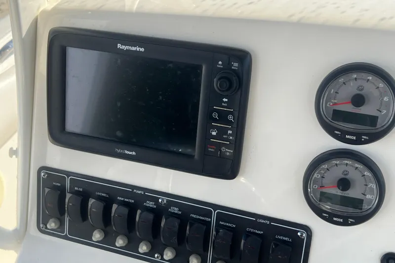 Slide: The Image of Control panel of 2015 Boston Whaler 220 Outrage with Raymarine display and gauges. - 20