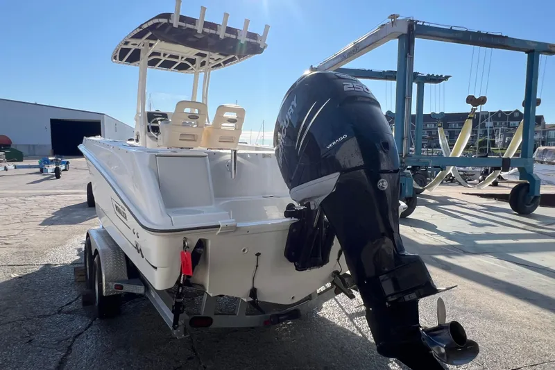 Slide: The Image of 2015 Boston Whaler 220 Outrage boat with Mercury Verado engine on trailer. - 5