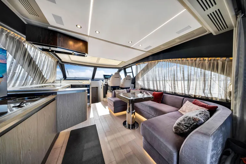 Slide: The Image of Luxurious interior of 2021 Azimut S6 yacht with modern furnishings and panoramic windows. - 12