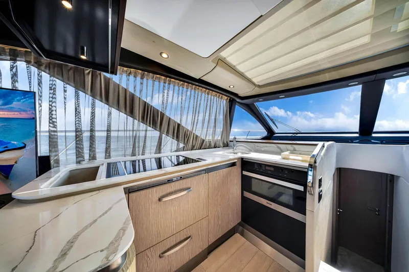 Slide: The Image of Luxurious kitchen interior of 2021 Azimut S6 yacht with modern appliances and ocean view. - 15