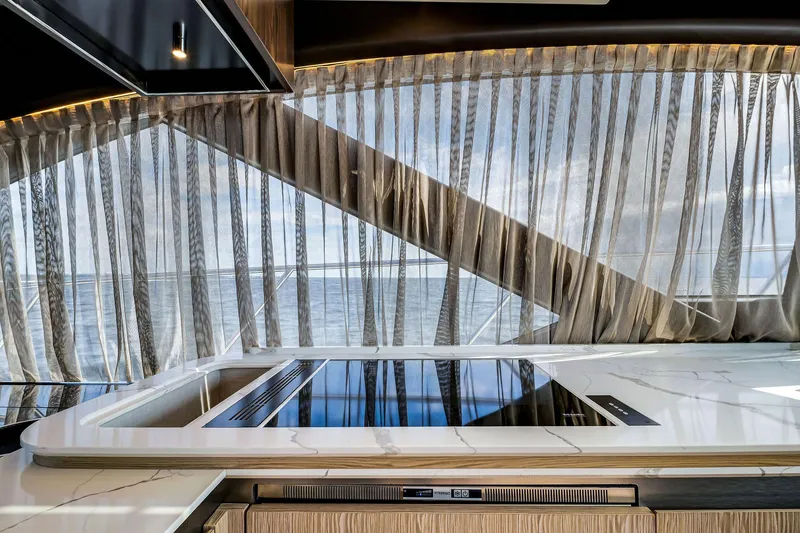 Slide: The Image of Luxurious interior of 2021 Azimut S6 yacht with modern kitchen and ocean view. - 17