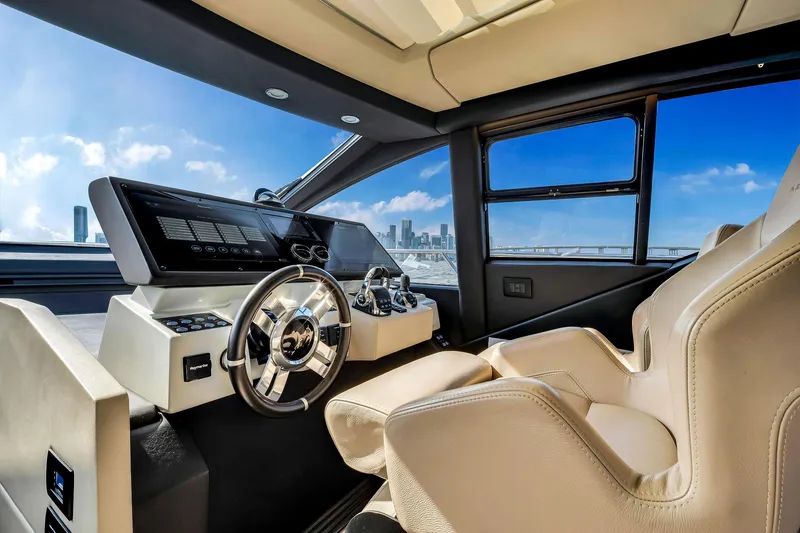 Slide: The Image of Luxurious 2021 Azimut S6 yacht cockpit with modern steering and city skyline view. - 18
