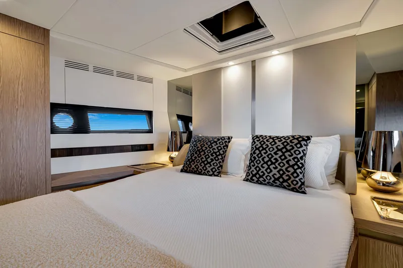 Slide: The Image of Luxurious bedroom interior of 2021 Azimut S6 yacht with modern decor and elegant lighting. - 32