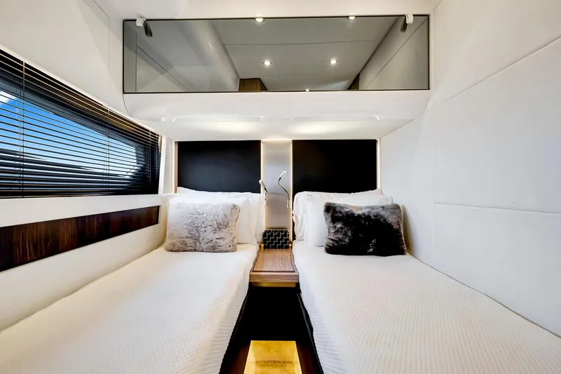 Slide: The Image of Luxurious 2021 Azimut S6 yacht cabin with twin beds, modern decor, and ambient lighting. - 41