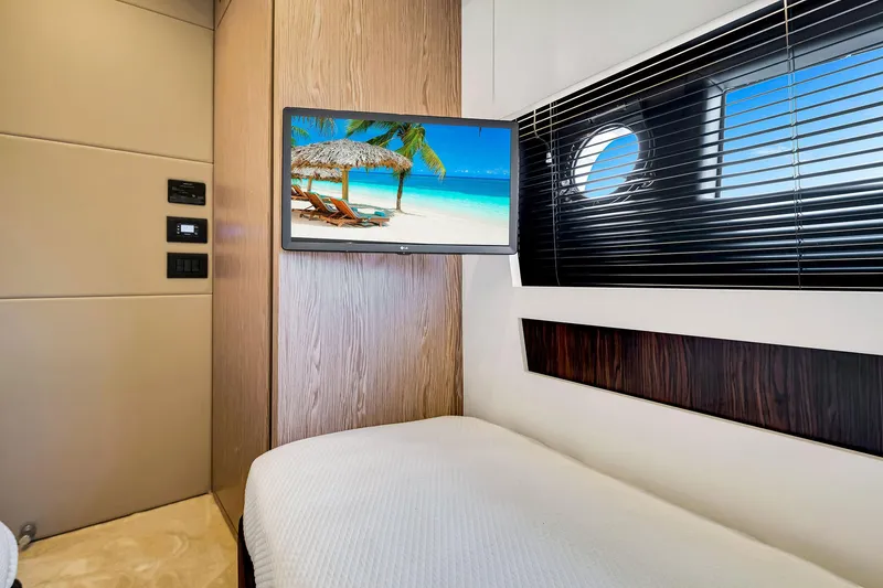 Slide: The Image of Luxurious interior of 2021 Azimut S6 yacht with TV and porthole view. - 43