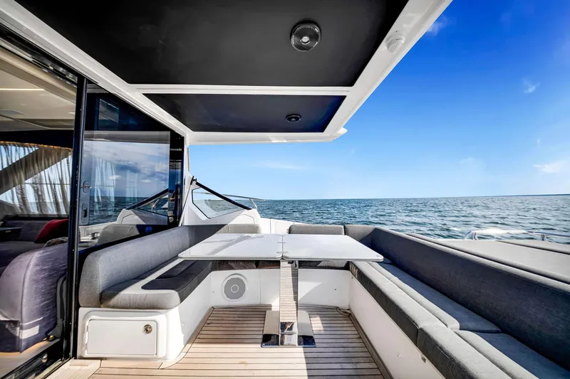 Slide: The Image of Luxurious 2021 Azimut S6 yacht deck with seating, ocean view, and modern design. - 6