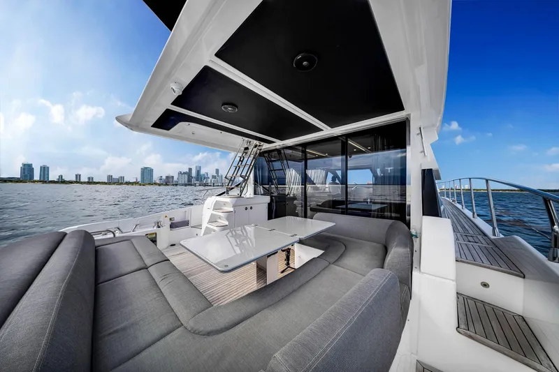 Slide: The Image of Luxurious 2021 Azimut S6 yacht with spacious deck and city skyline view. - 7