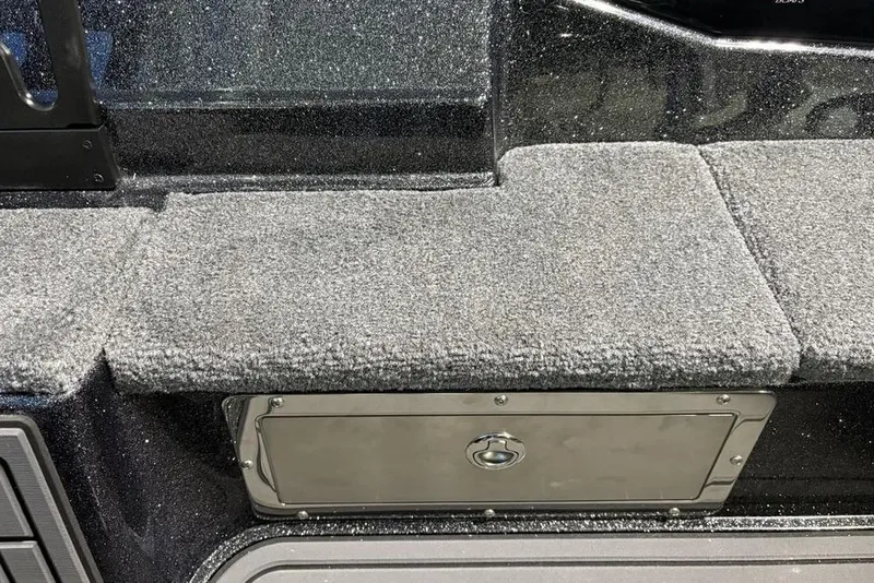 Slide: The Image of Carpeted storage compartment on a 2026 Phoenix 920 Elite X boat. - 13