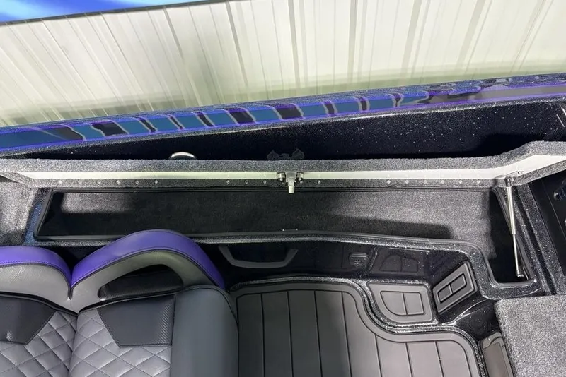 Slide: The Image of Interior of 2026 Phoenix 920 Elite X, featuring sleek seating and storage compartment. - 21