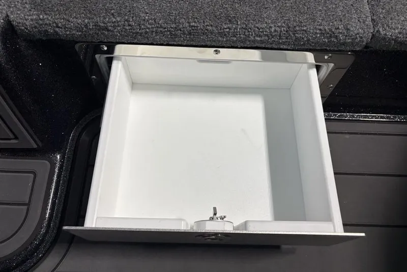 Slide: The Image of Open storage compartment in 2026 Phoenix 920 Elite X boat interior. - 22
