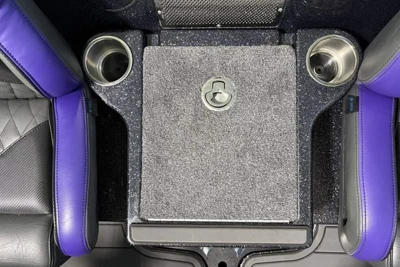 Slide: The Image of Interior of 2026 Phoenix 920 Elite X with purple accents and cup holders. - 26