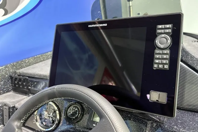 Slide: The Image of Dashboard of 2026 Phoenix 920 Elite X with Humminbird display and steering wheel. - 27