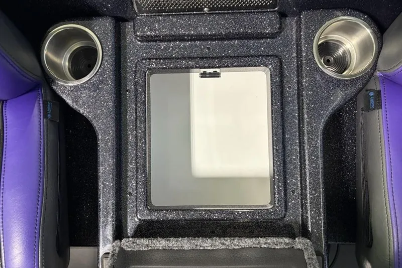 Slide: The Image of Interior of 2026 Phoenix 920 Elite X with cup holders and storage compartment. - 28