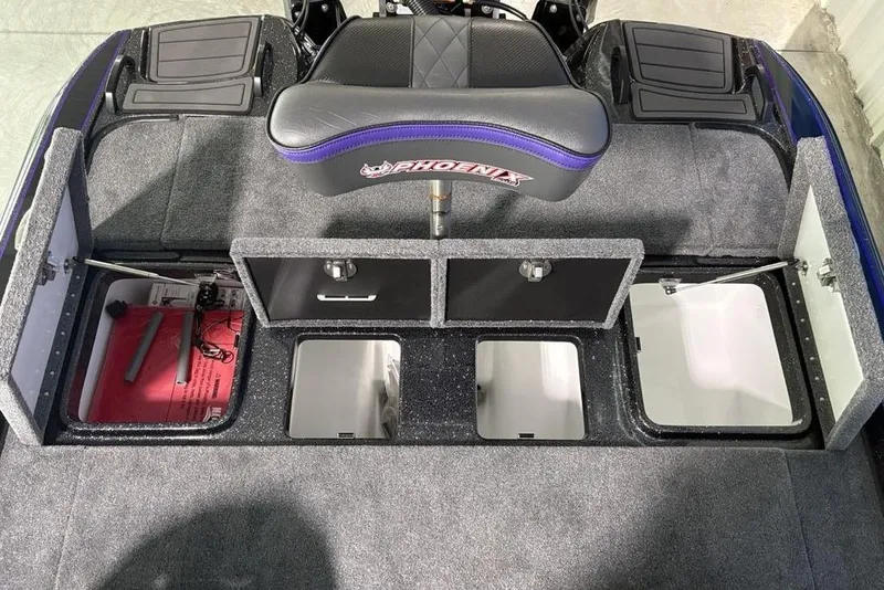 Slide: The Image of 2026 Phoenix 920 Elite X boat interior with storage compartments and seating. - 31