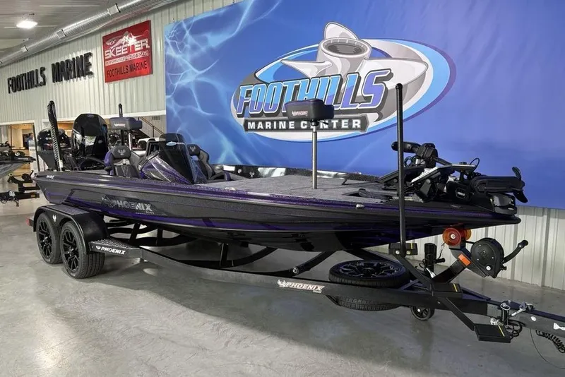 Slide: The Image of 2026 Phoenix 920 Elite X boat displayed at Foothills Marine Center showroom. - 4