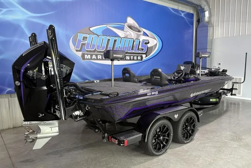 Slide: The Image of 2026 Phoenix 920 Elite X boat displayed at Foothills Marine Center showroom. - 5