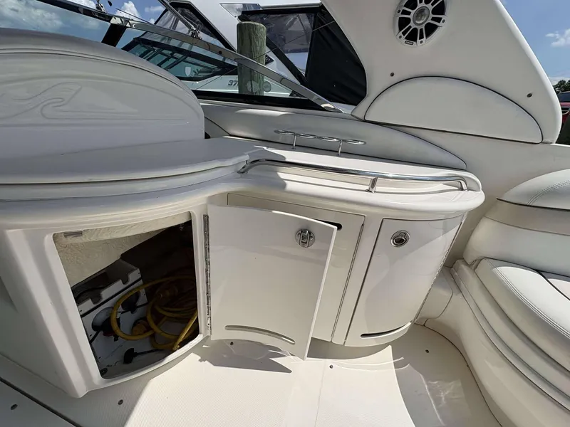 Slide: The Image of 2008 Sea Ray 290 SLX boat interior with open storage compartment and seating. - 15