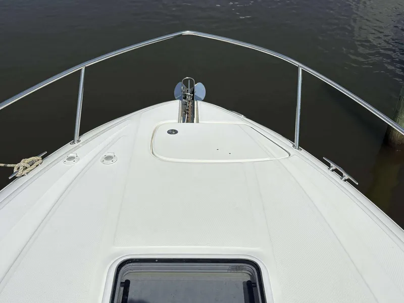 Slide: The Image of Bow of 2008 Sea Ray 290 SLX boat with stainless steel railings. - 18