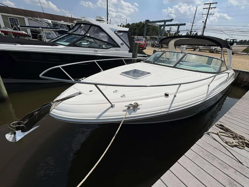 Slide: The Image of 2008 Sea Ray 290 SLX boat docked at marina under sunny skies. - 3