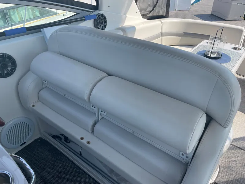 Slide: The Image of 2007 Chaparral 330 Signature boat interior with white leather seating and built-in speakers. - 19