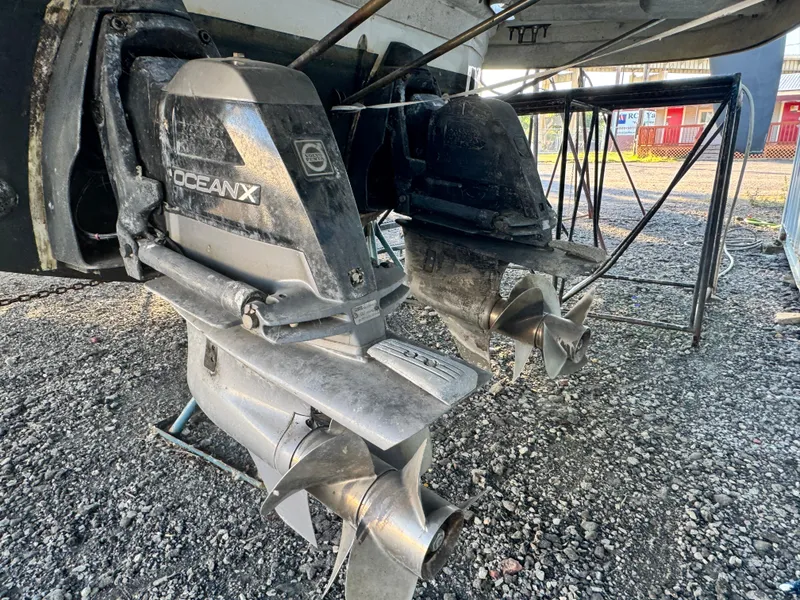 Slide: The Image of 2007 Chaparral 330 Signature boat with OceanX outdrive, displayed on gravel surface. - 23