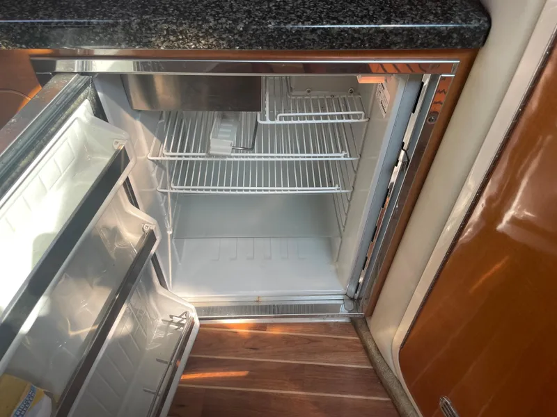 Slide: The Image of Open refrigerator in 2007 Chaparral 330 Signature boat galley. - 31