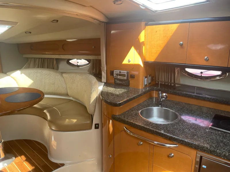 Slide: The Image of Interior of 2007 Chaparral 330 Signature yacht with kitchen and seating area. - 32