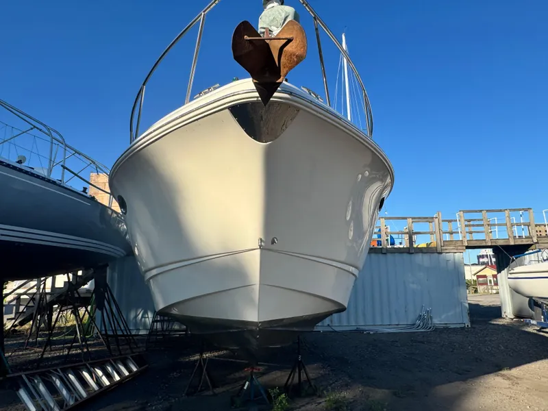 Slide: The Image of 2007 Chaparral 330 Signature boat on stands, viewed from the front, under clear blue sky. - 4